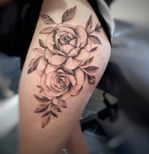 flower tattoo on woman's leg