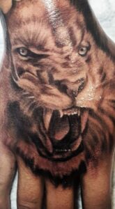 lion hand tattoo